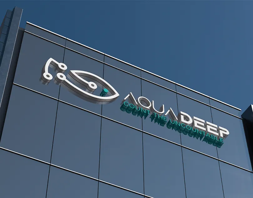 Aquadeep logo in dimensional letters on a glass office building