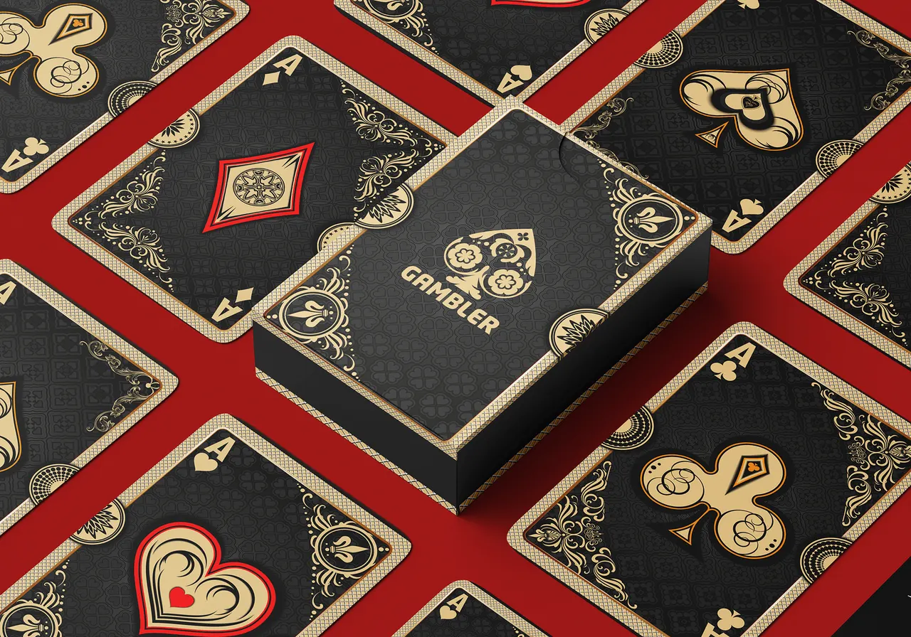 Gambler card box surrounded by black and gold aces on a red table
