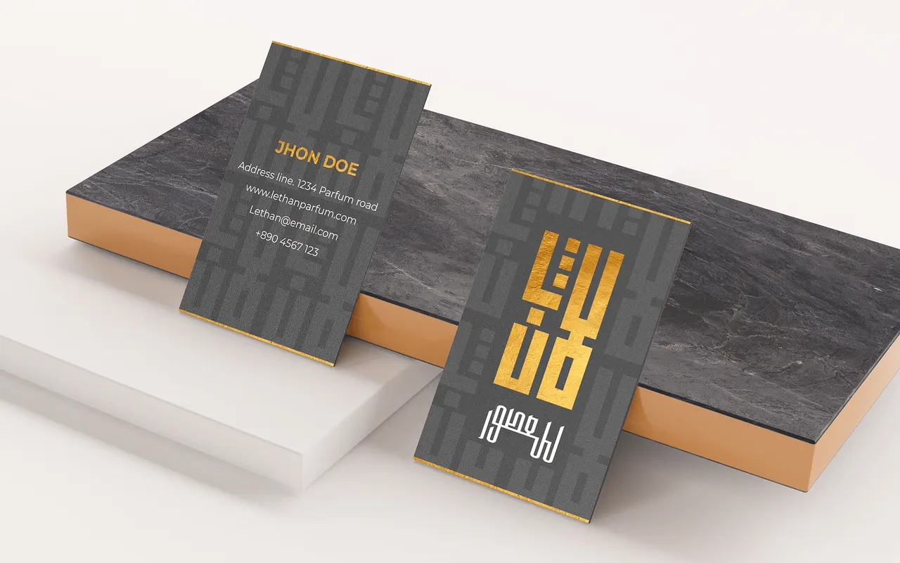 Lafen business cards in grey and gold on a marble block