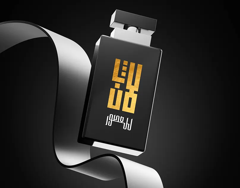 Black perfume bottle with a gold square Kufic Lafen logo, wrapped in a black ribbon